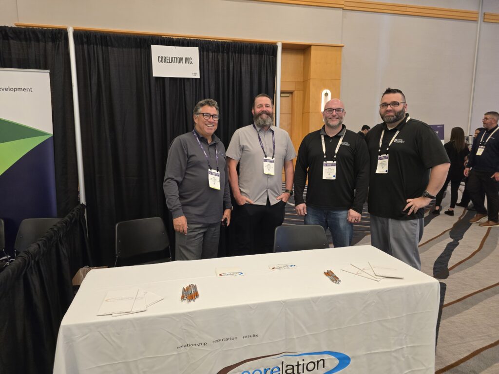 Corelation team and credit union attendees at the Corelation booth during the Operations and Technology Councils' Conference